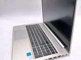 a laptop computer sitting on a white surface