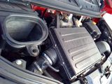 the engine of a car with its hood open and the hood up