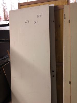 a refrigerator that is sitting in the corner of a room