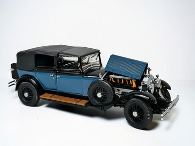 a model of a blue car with a black top