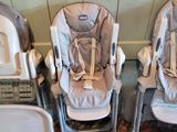 three baby highchairs that are lined up against the wall