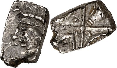 two pieces of silver metal with a cross on it