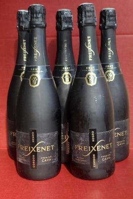 six bottles of brixet champagne on a red background
