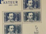an image of a stamp with a picture of a man and a microscope
