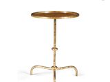 a round brass side table with a wooden top