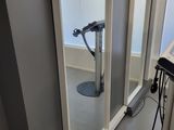 an image of a room with a mirror and a treadmill