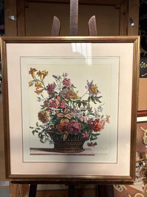 une photo d'une photo représentant un panier de fleurs exposé