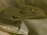 a piece of fabric that has been torn off of