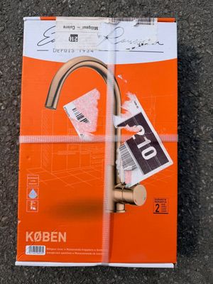 an orange book with a picture of a faucet on it