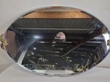a mirror that is sitting on top of a table