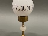 an image of a white and gold table lamp with roman numerals on it