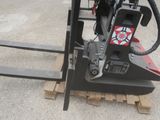 a fork on a pallet that is sitting on a pallet