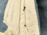 a close up of a piece of clothing with holes in it