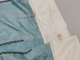 a piece of fabric that has been stitched together with a pair of scissors