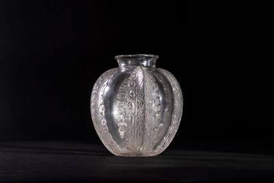 a glass vase that is sitting on a table