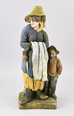 figurine représentant un garçon et une fille portant un chapeau et une écharpe