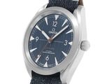 a close up of a watch on a white background with a blue dial