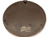 the plate is brown and has a gold lettering on it