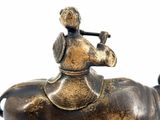 a bronze statue of a man riding a horse