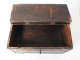 an old wooden box that is open on a white surface