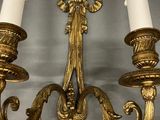 pair of antique brass wall sconces with frosted glass shades