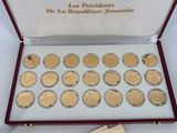 an image of a box of coins and some cards on a table