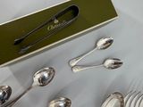 a lot of silver spoons and forks on a table