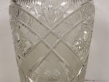 a glass vase that is sitting on a table