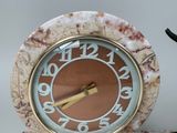 a clock that is sitting on top of a table