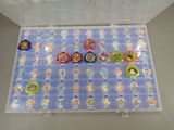 a display case with a lot of disney princess charms on it