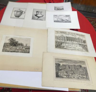 a lot of pictures on a table with a red table cloth