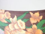 a pillow with a picture of a bunch of flowers on it