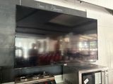 a television mounted on the wall in a kitchen