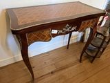 a small table with a checkered top on it