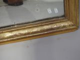a reflection of a person in a mirror on the wall