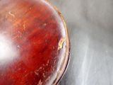 a close up of a wooden object on a table