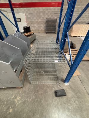 a metal rack in the middle of a warehouse