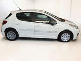 a picture of a white car parked in a garage