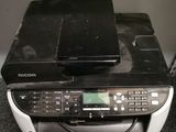 a black and white printer sitting on top of a desk