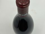 a bottle of wine that is sitting on a table
