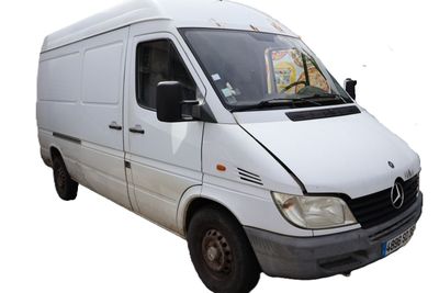 a white van that is parked on the side of the road