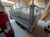 a truck that has a cage on the back of it