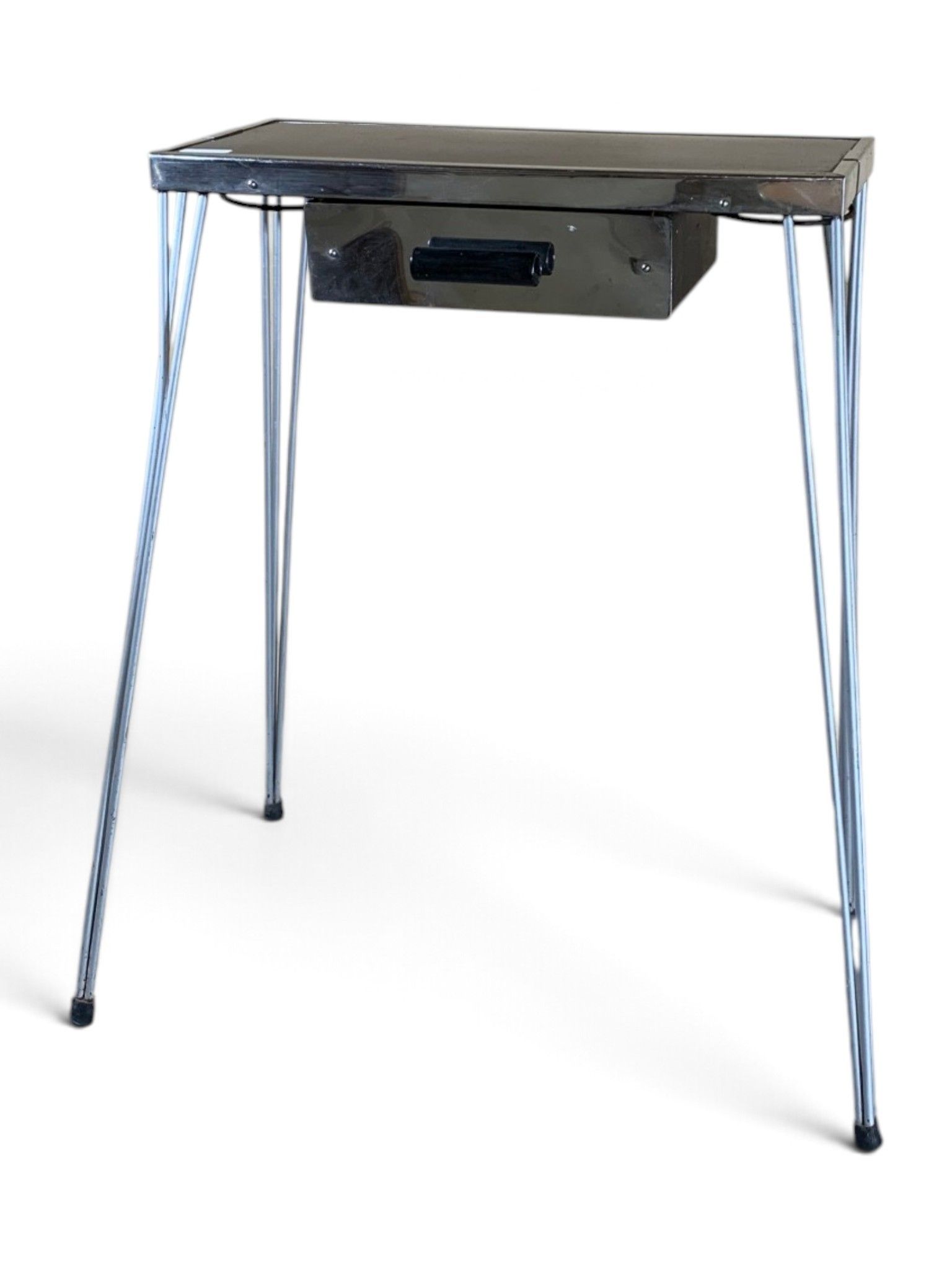 Petite console en métal chromé, ouvrant par un tiroir en cei…