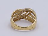 a close up of a gold ring on a white surface
