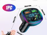 an image of a hand holding a car charger with a digital display