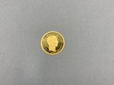 une pièce d'or sur laquelle est représentée la tête d'un homme