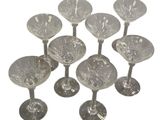 six clear glass wine glasses sitting on top of each other