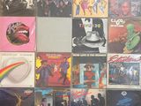 a lot of different album covers on the wall