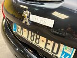 a close up of a car ' s license plate on the back of a car