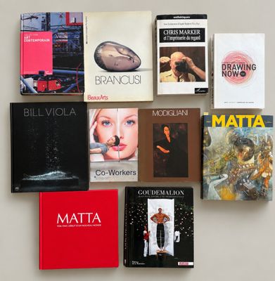 a lot of books on the wall that are on display